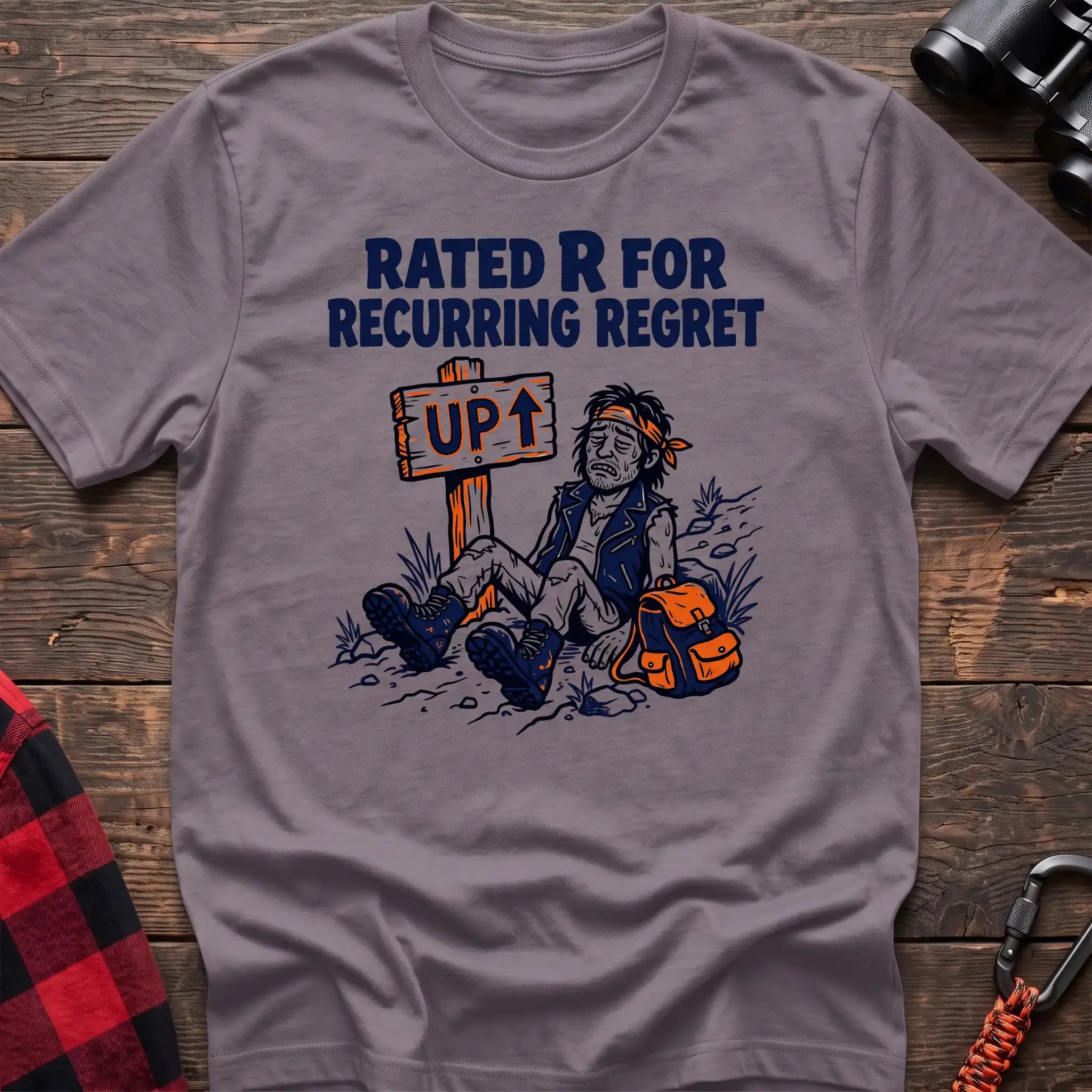 Paragon t-shirt with illustration of an exhausted hiker sitting by an UP trail sign and the text Rated R for Recurring Regret