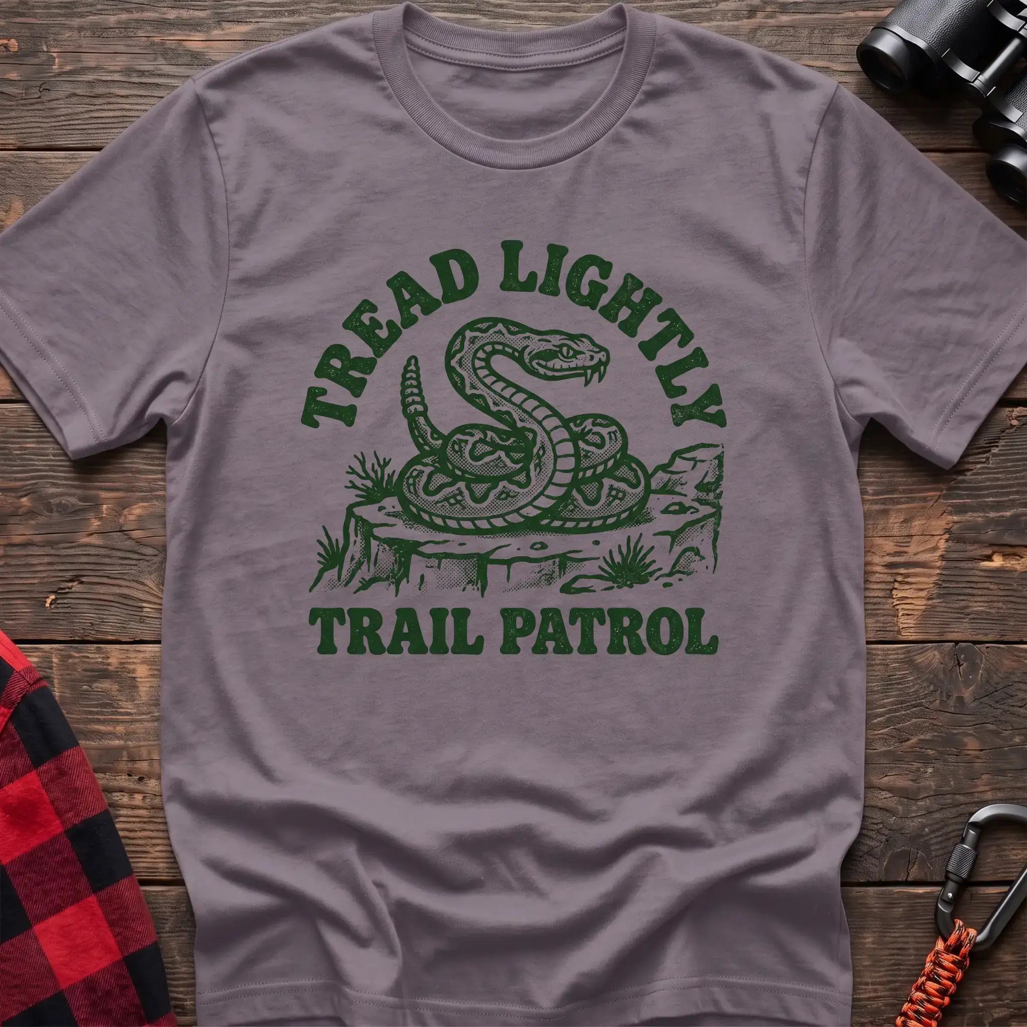 Paragon t-shirt with dark green rattlesnake illustration and the text Tread Lightly Trail Patrol