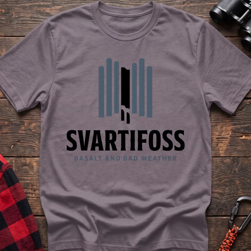 Paragon cotton t-shirt with a basalt column graphic and Svartifoss Basalt and Bad Weather text on rustic wood