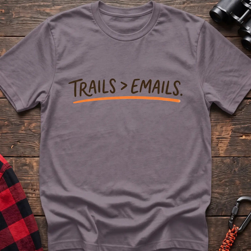 Paragon t-shirt with brown handwritten-style text reading Trails greater than Emails and an orange underline