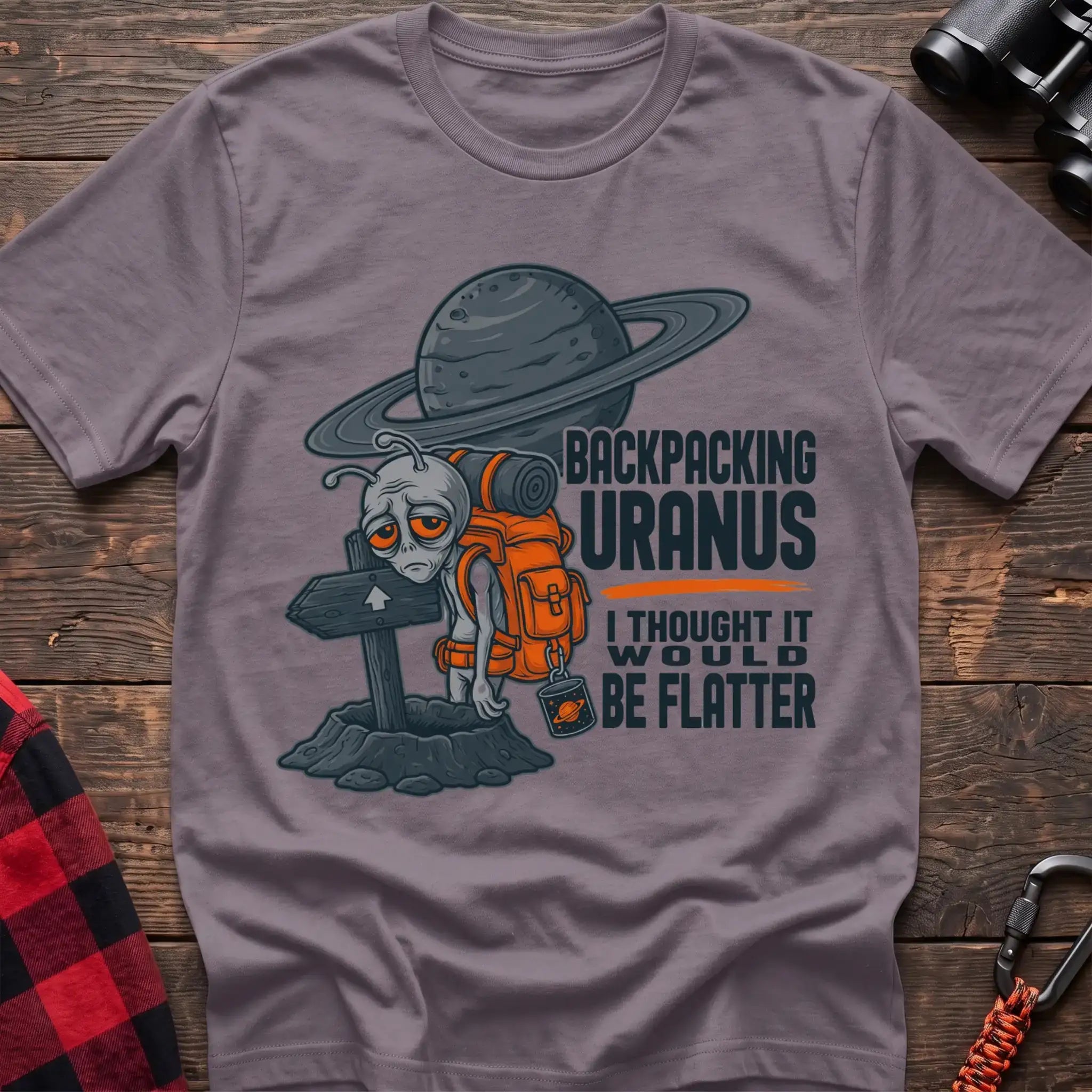 Paragon t-shirt with tired alien backpacker next to a trail sign and the text Backpacking Uranus I Thought It Would Be Flatter