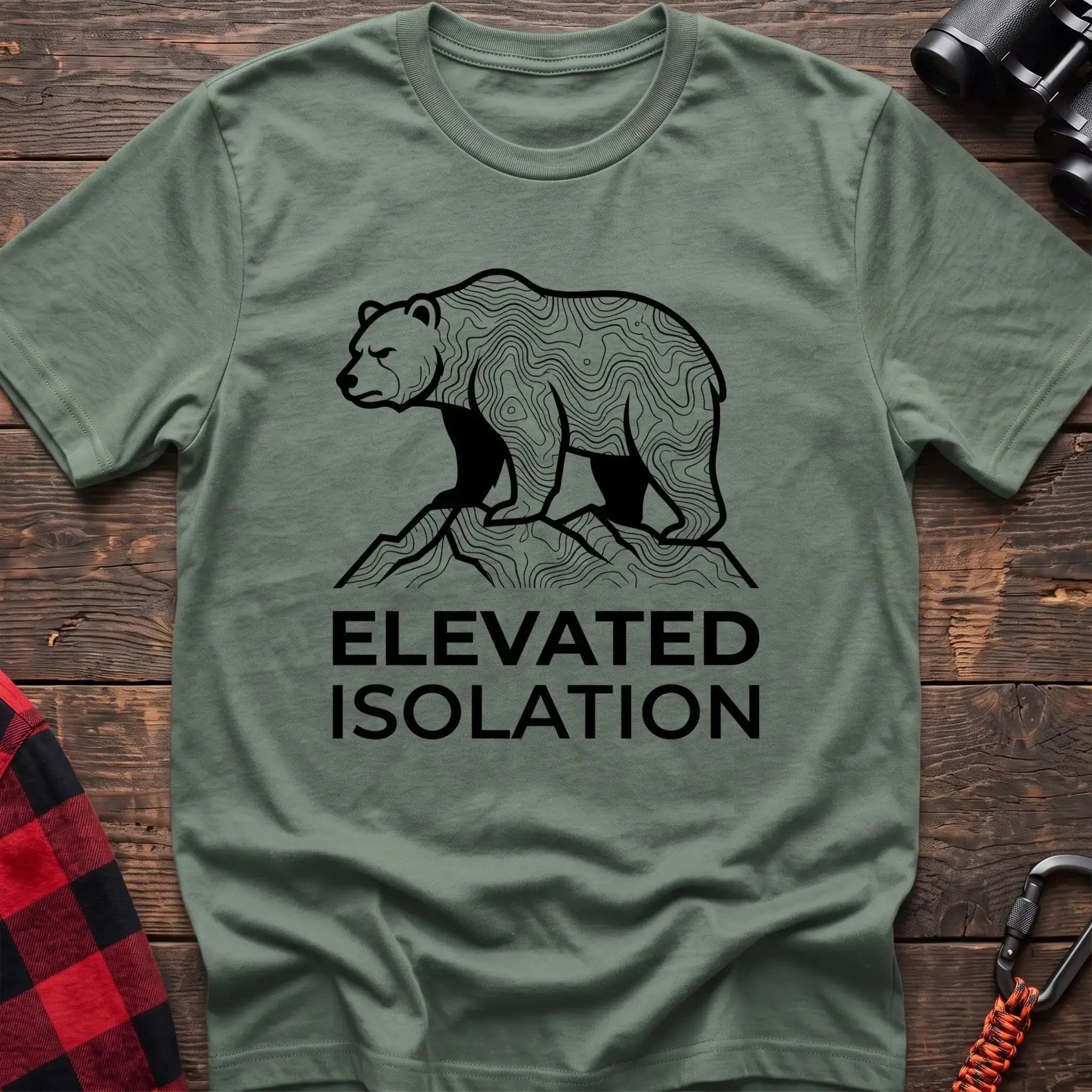 Sage t-shirt with topographic bear standing on a mountain peak and the text Elevated Isolation