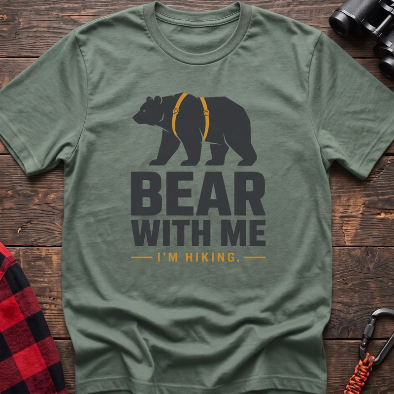 Sage cotton hiking t-shirt with black bear wearing a backpack and the text “Bear With Me I’m Hiking”