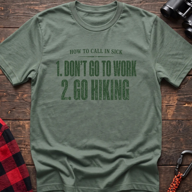 Sage cotton t-shirt with How to Call in Sick Don’t Go to Work Go Hiking text on rustic wood