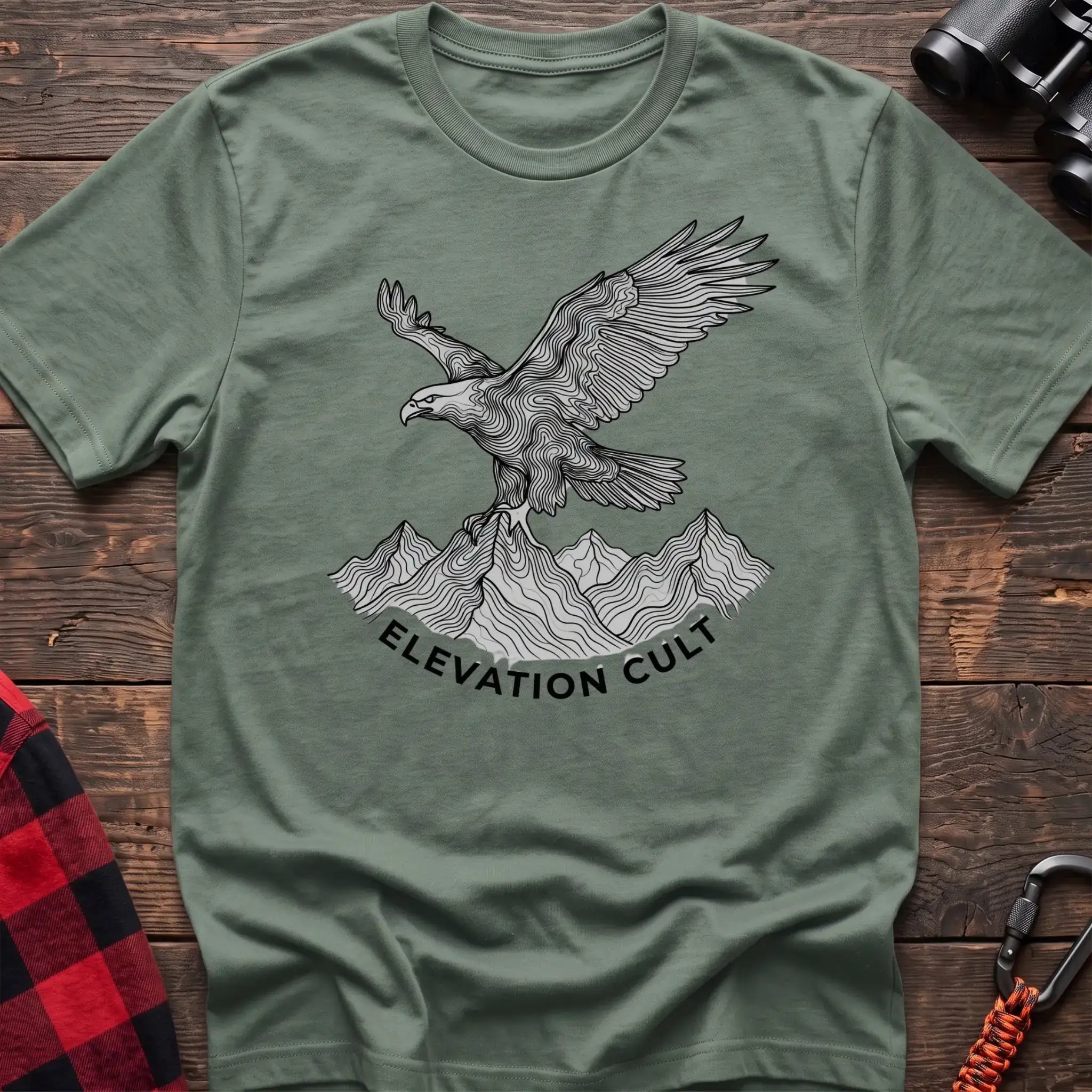 Sage t-shirt with detailed eagle perched on mountains graphic and the text Elevation Cult