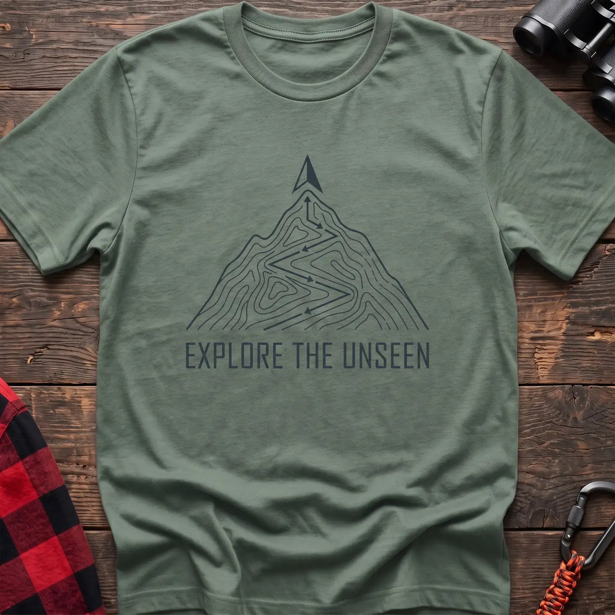Sage t-shirt with topographic mountain trail graphic and the text Explore the Unseen