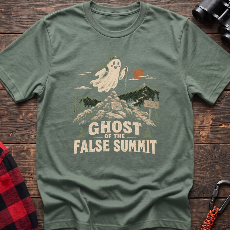 Sage cotton t-shirt with a hiking ghost graphic and Ghost of the False Summit text on rustic wood