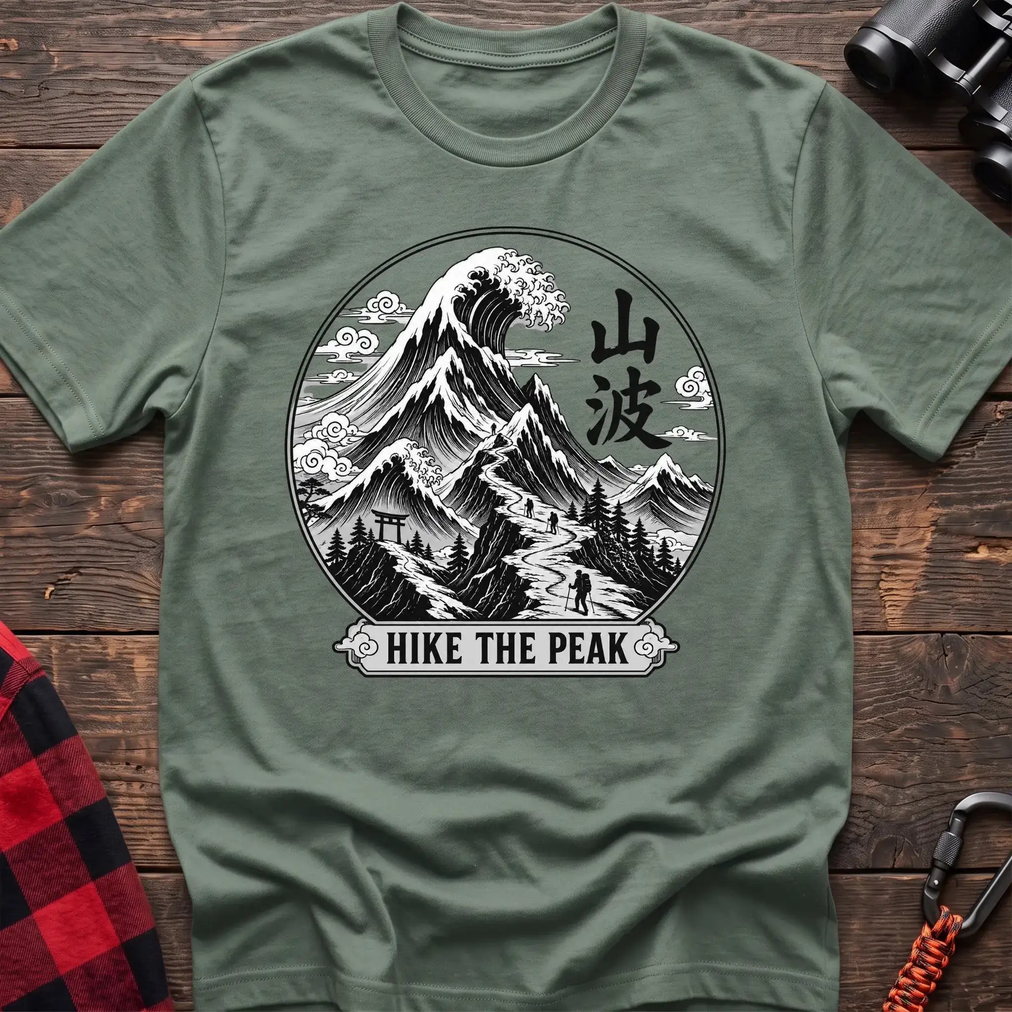Sage t-shirt with circular Japanese-style mountain and wave graphic featuring hikers and the text Hike the Peak