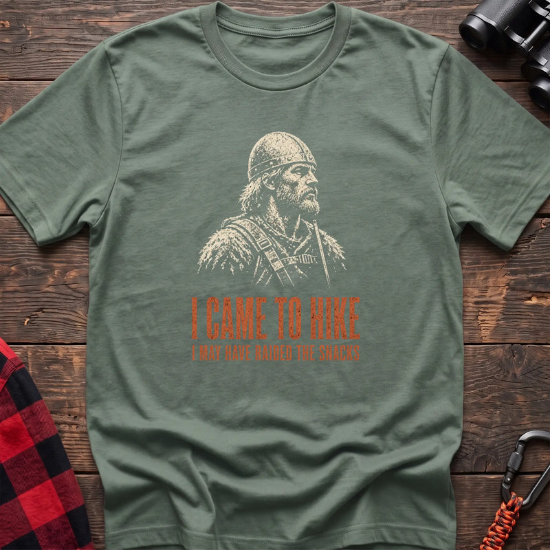 Sage cotton t-shirt with a Viking graphic and I Came to Hike I May Have Raided the Snacks text on rustic wood