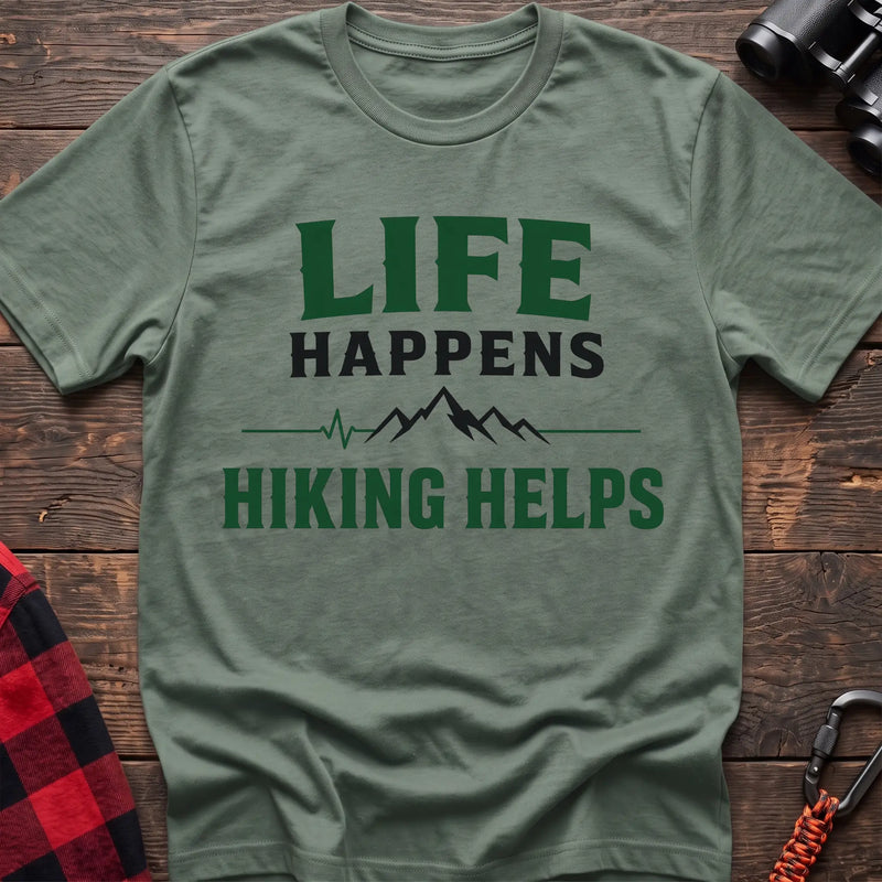 Sage cotton t-shirt with a mountain heartbeat graphic and Life Happens Hiking Helps text on rustic wood