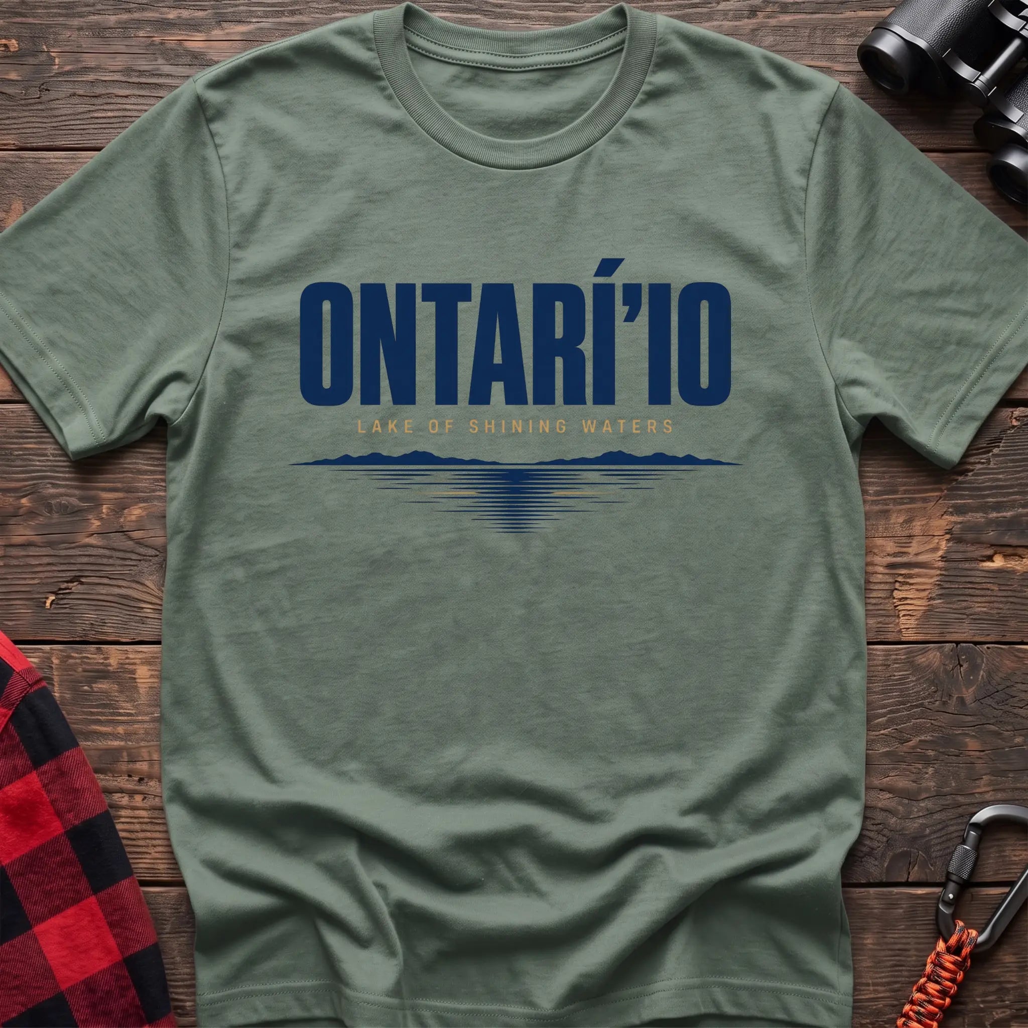 Sage cotton hiking t-shirt with Ontarí'io Lake of Shining Waters text and stylized lake reflection graphic