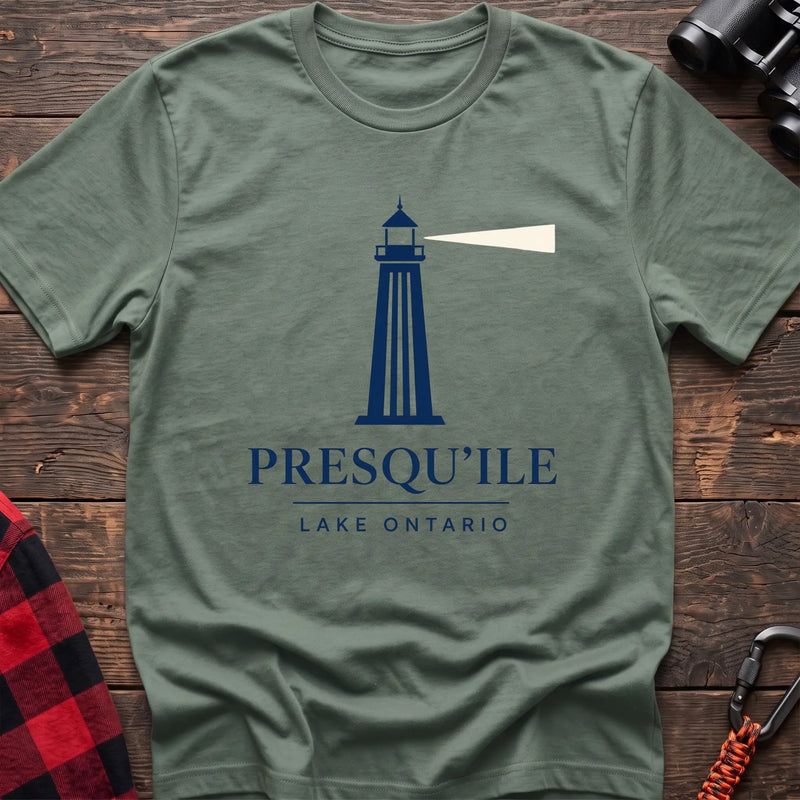 Sage cotton t-shirt with a navy lighthouse graphic and the text “Presqu’ile Lake Ontario”