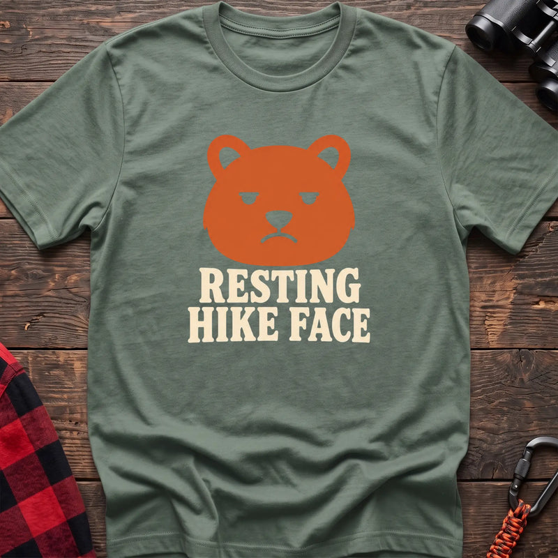 Sage cotton t-shirt with a grumpy bear graphic and Resting Hike Face text on rustic wood