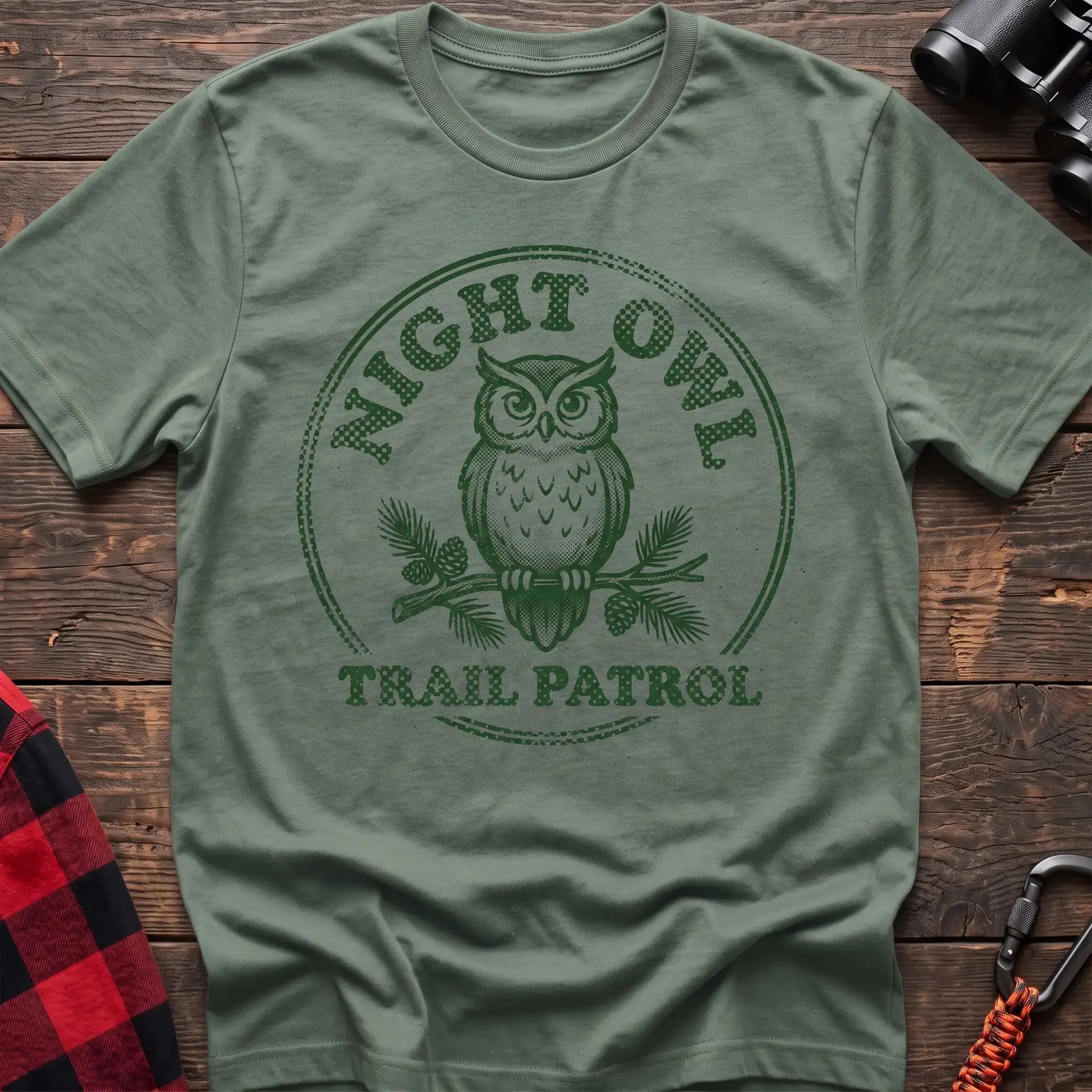 Sage t-shirt with green owl on a pine branch graphic and the text Night Owl Trail Patrol