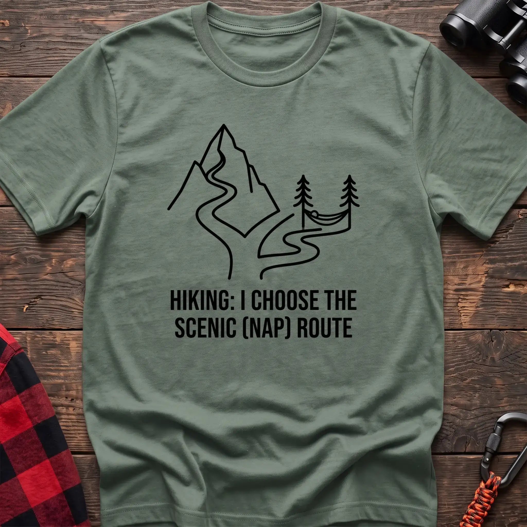 Sage t-shirt with minimalist mountain trail and hammock graphic reading Hiking I Choose the Scenic Nap Route