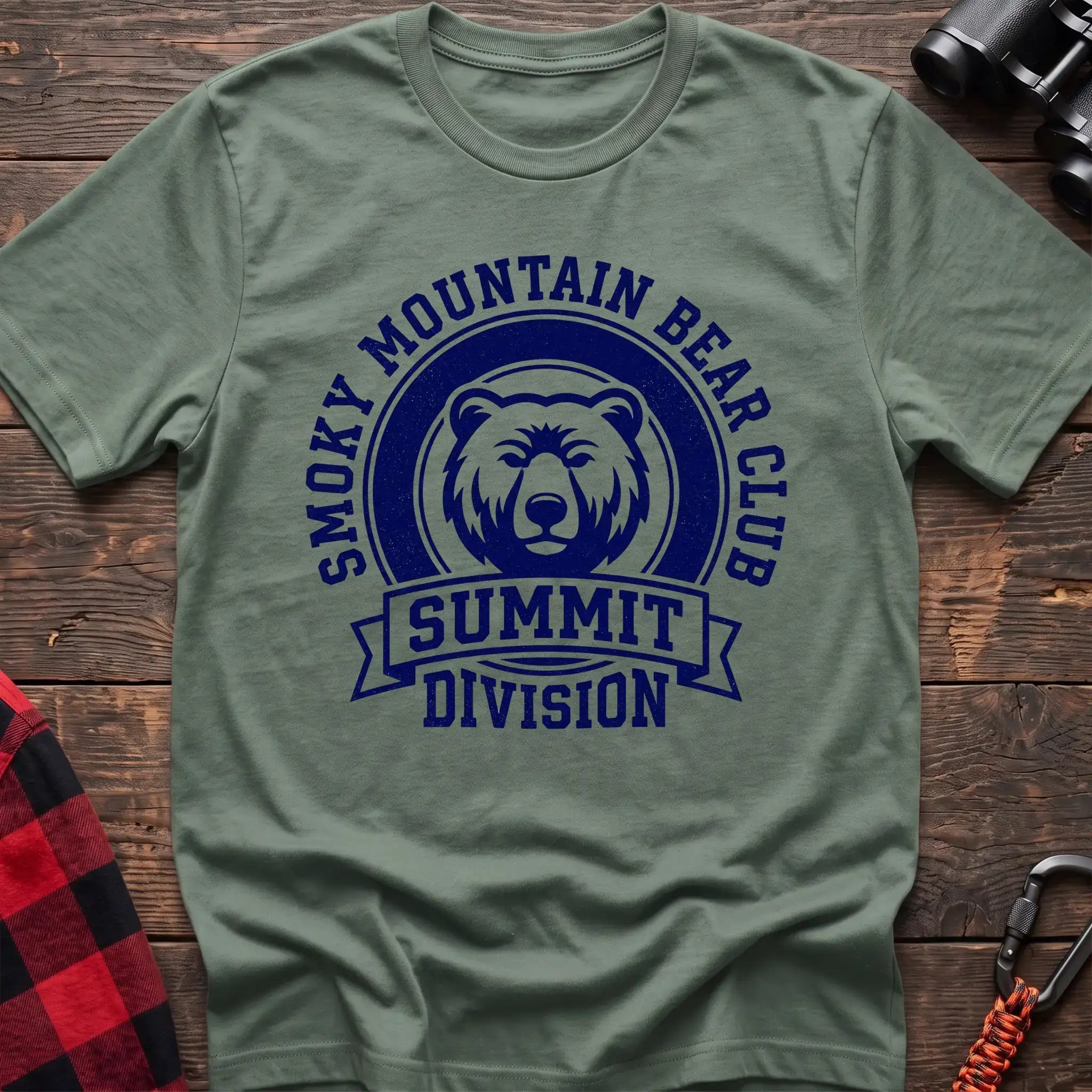 Sage t-shirt with circular badge graphic of a bear face reading Smoky Mountain Bear Club Summit Division