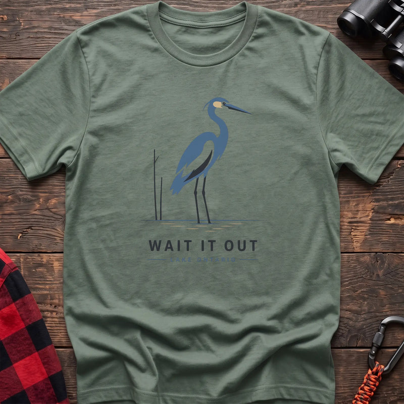 Sage hiking t-shirt with a blue heron graphic and the text “Wait It Out Lake Ontario”