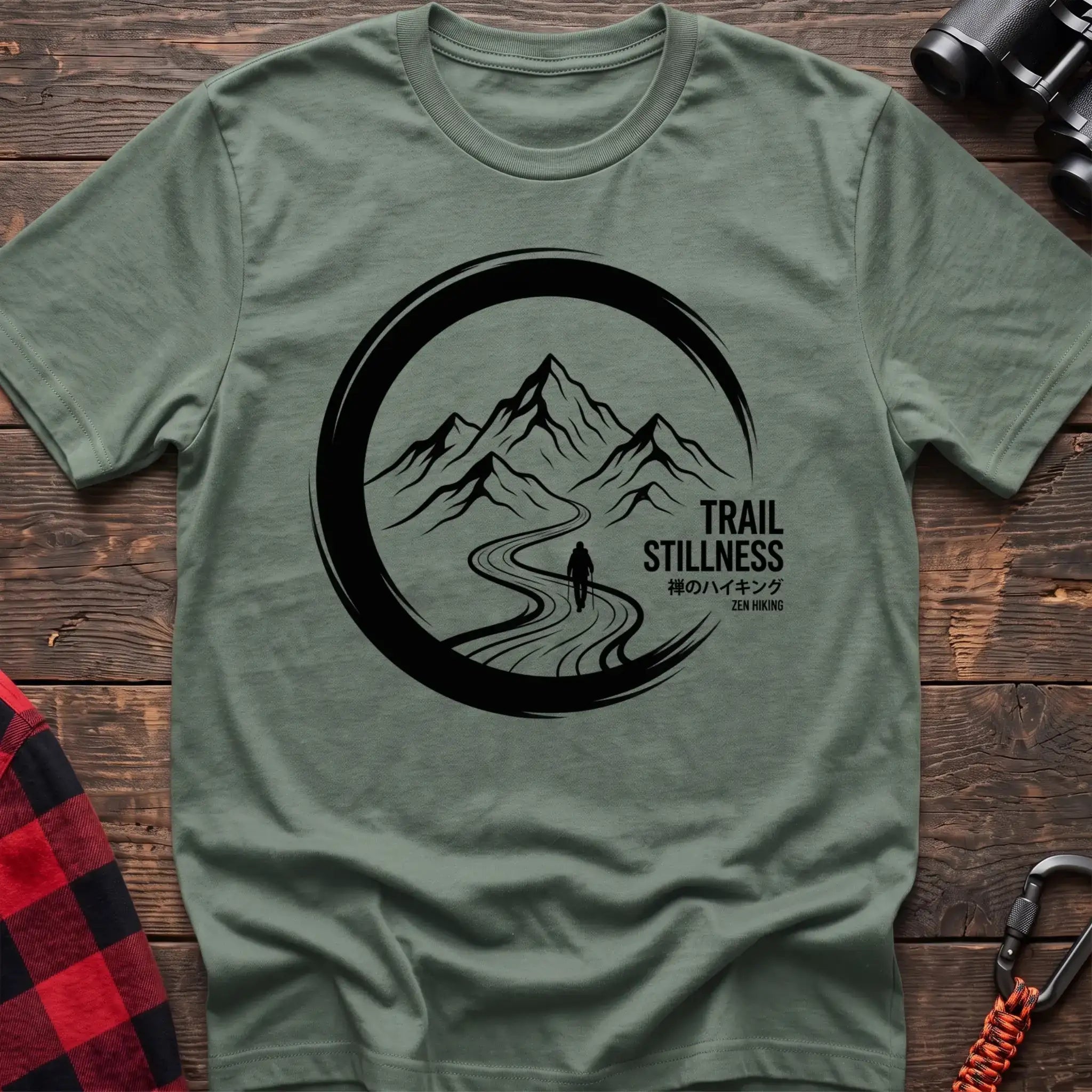 Sage t-shirt with circular mountain trail graphic of a hiker and the text Trail Stillness Zen Hiking