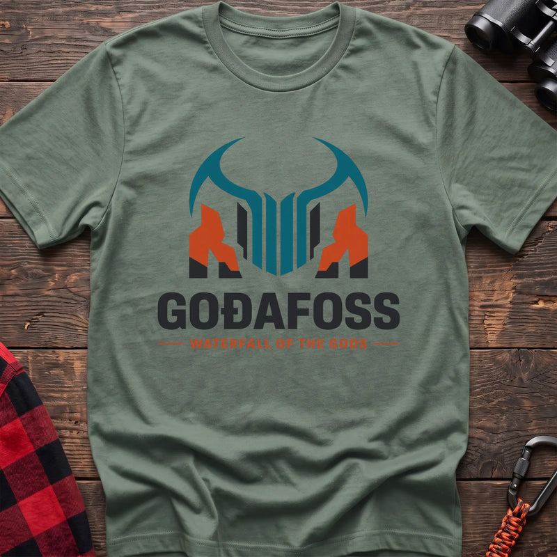 Sage cotton t-shirt with a basalt column graphic and Svartifoss Basalt and Bad Weather text on rustic wood