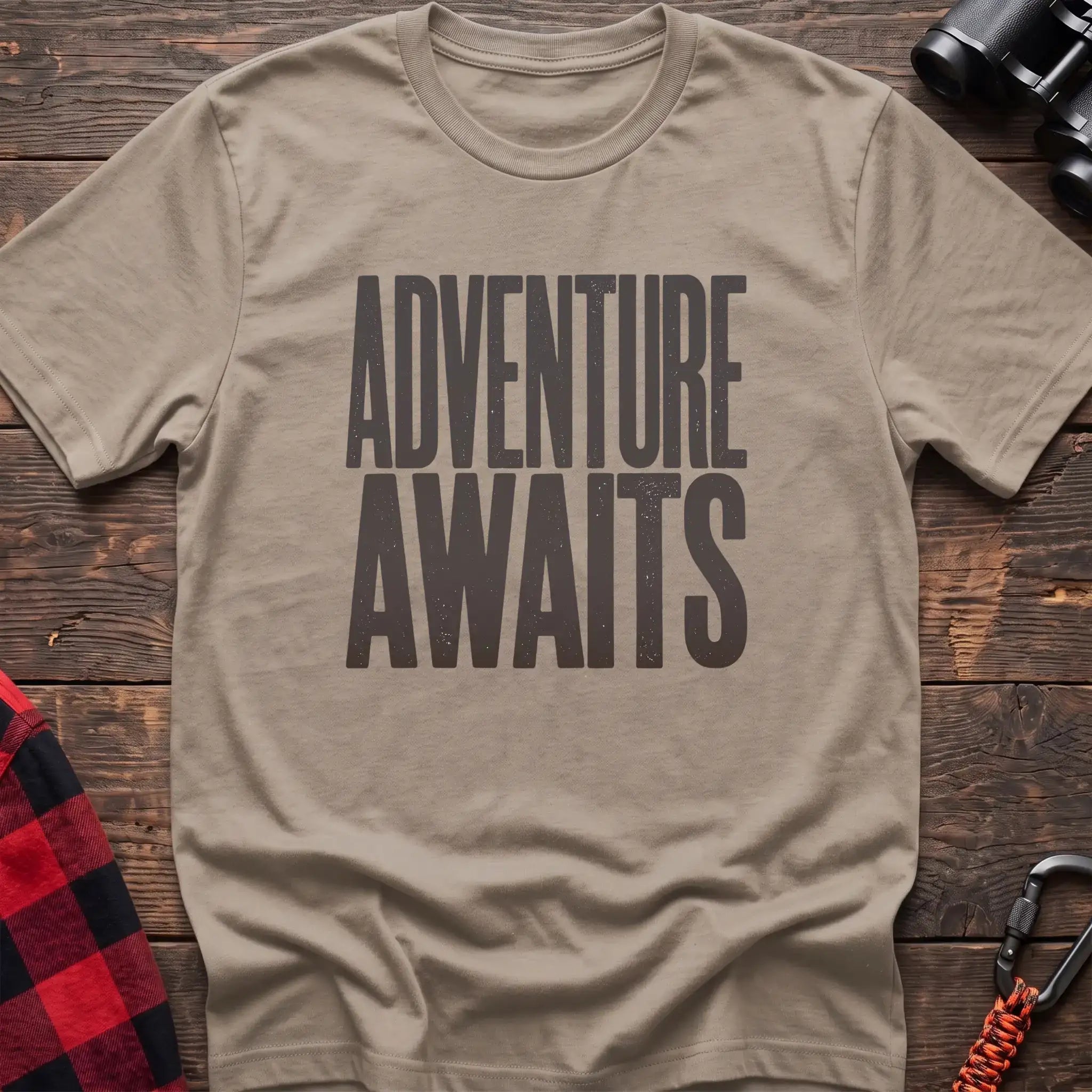 Sand t-shirt with large distressed gray text reading Adventure Awaits