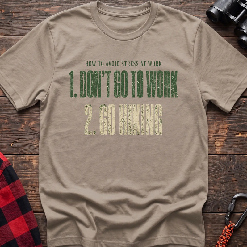 Sand cotton t-shirt with How to Avoid Stress at Work Don’t Go to Work Go Hiking text on rustic woo