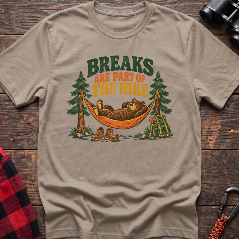 Sand cotton t-shirt with a bear in a hammock graphic and Breaks Are Part of the Hike text on rustic wood