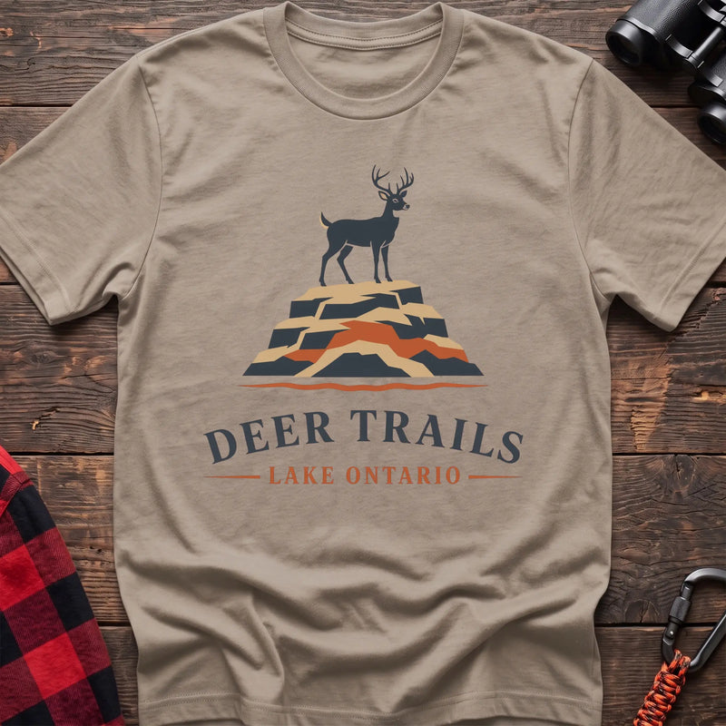 Sand hiking t-shirt with a deer on a rocky bluff and the text “Deer Trails Lake Ontario”