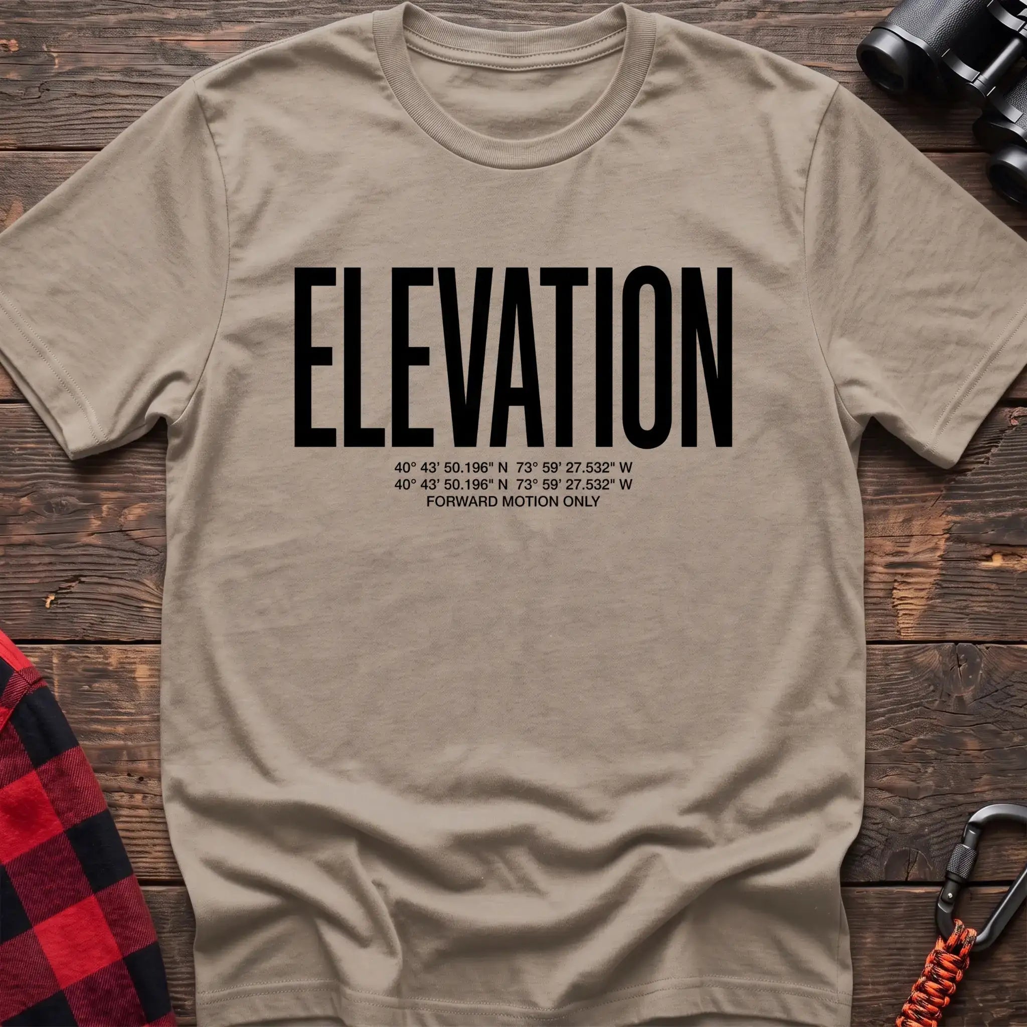Sand t-shirt with large black text reading Elevation and GPS coordinates with Forward Motion Only