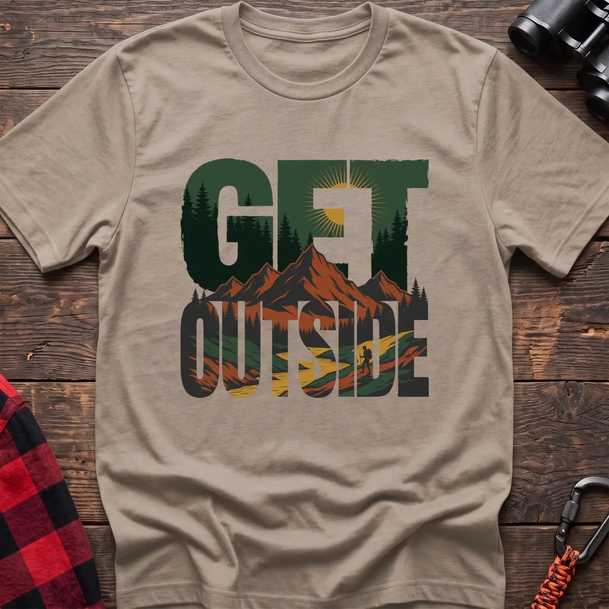 Sand t-shirt with layered mountain landscape graphic integrated into the text Get Outside