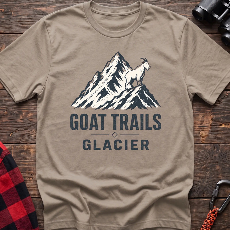 Sand cotton t-shirt with a mountain goat on a peak graphic and Goat Trails Glacier text on rustic wood