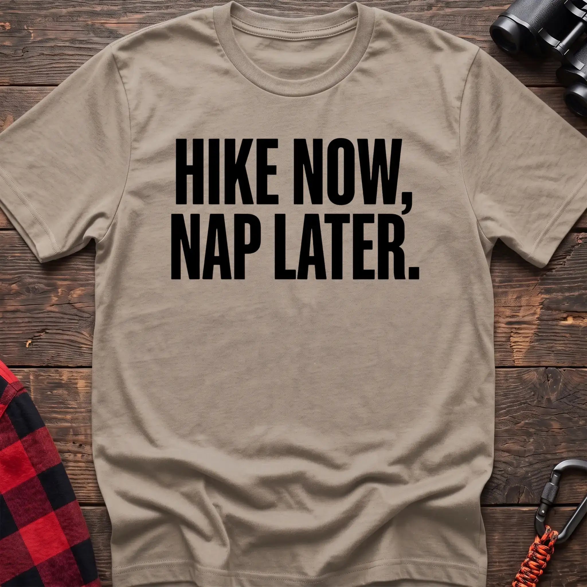 Sand t-shirt with bold black text reading Hike Now, Nap Later