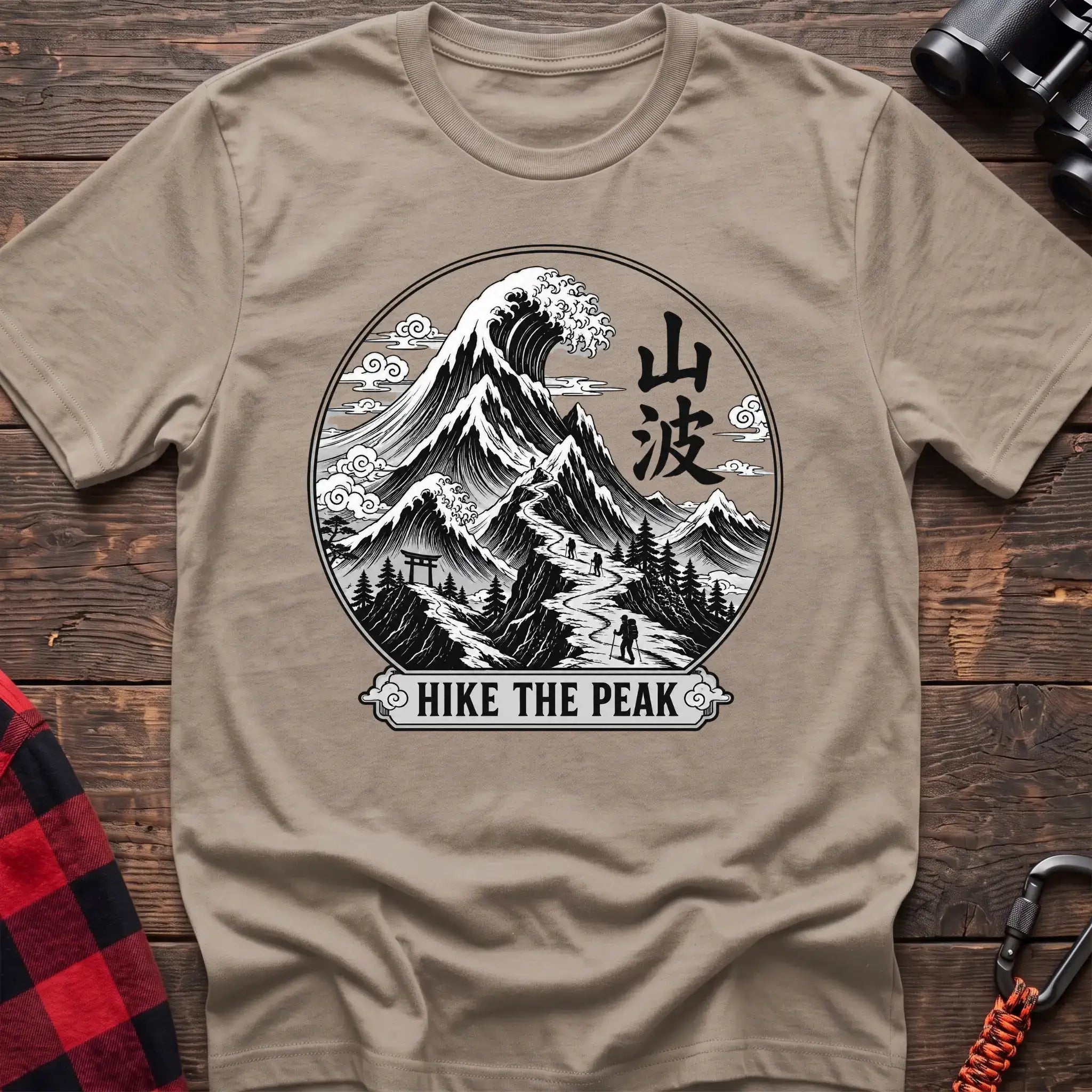 Sand t-shirt with circular Japanese-style mountain and wave graphic featuring hikers and the text Hike the Peak