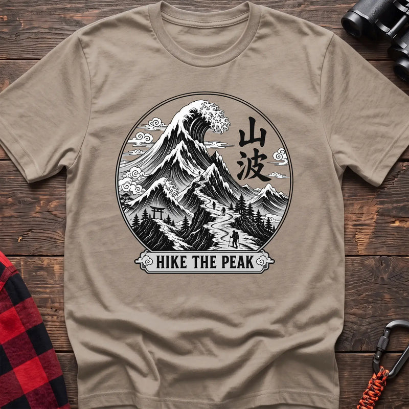 Sand t-shirt with circular Japanese-style mountain and wave graphic featuring hikers and the text Hike the Peak