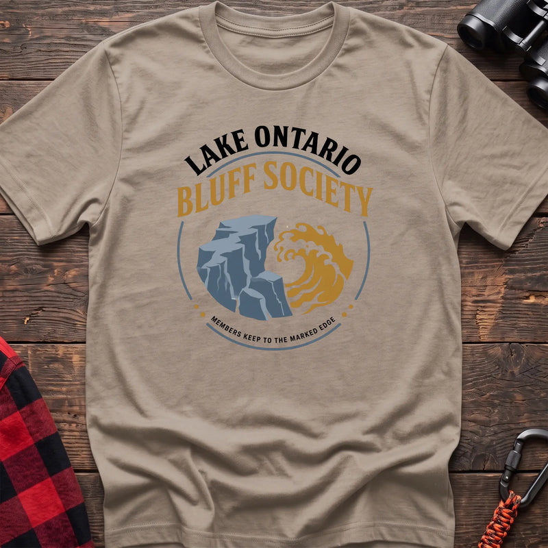 Sand hiking t-shirt with Lake Ontario Bluff Society badge showing a cliff, wave, and Members Keep to the Marked Edge
