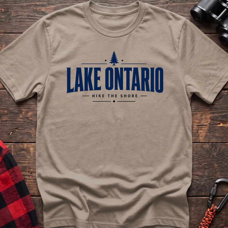 Sand cotton hiking t-shirt with pine tree icon and "Lake Ontario hike the shore" text