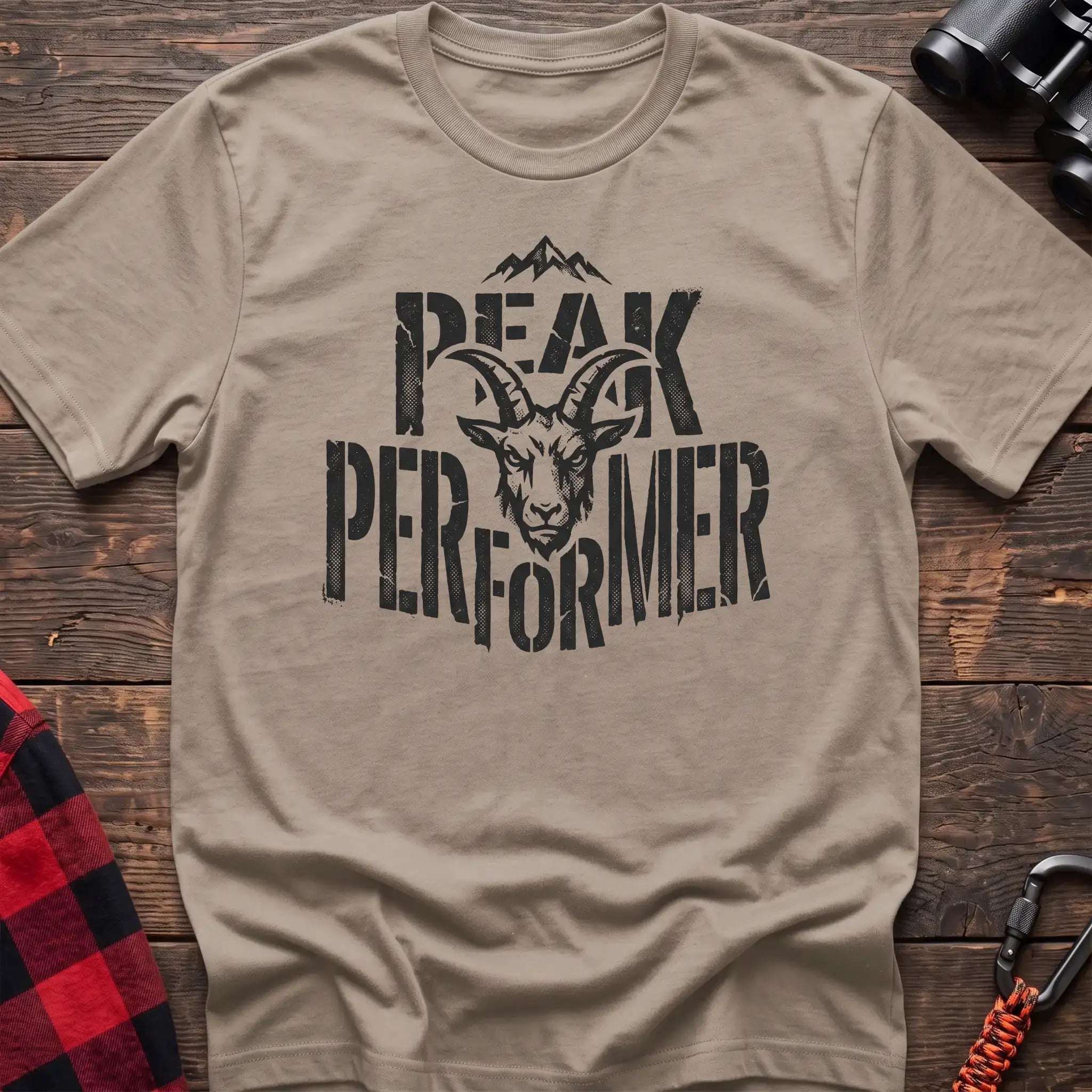 Sand t-shirt with mountain goat head graphic and the text Peak Performer
