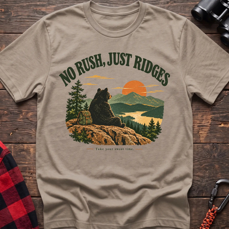 Sand cotton t-shirt with a bear on a ridge graphic and No Rush Just Ridges text on rustic wood