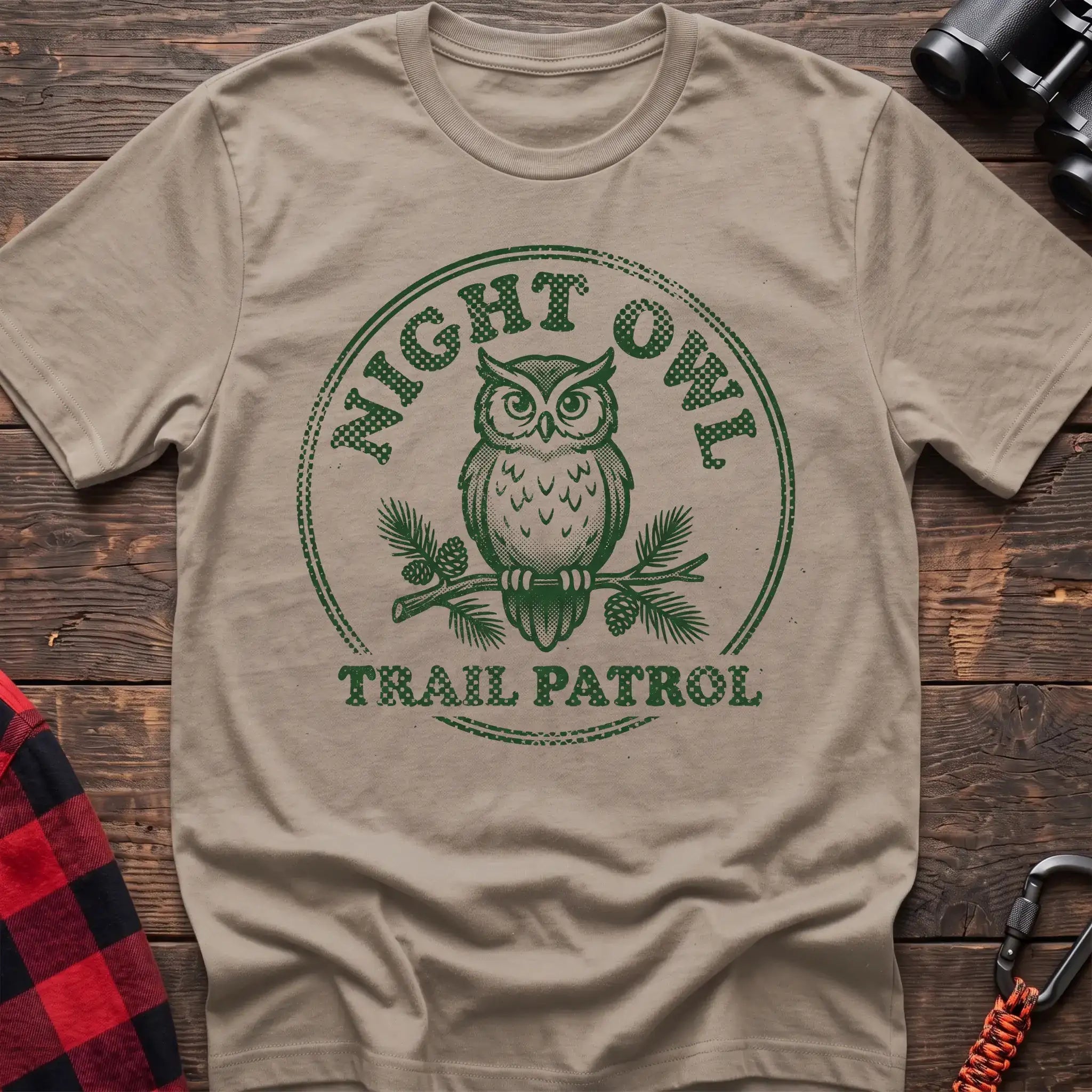 Sand t-shirt with green owl on a pine branch graphic and the text Night Owl Trail Patrol