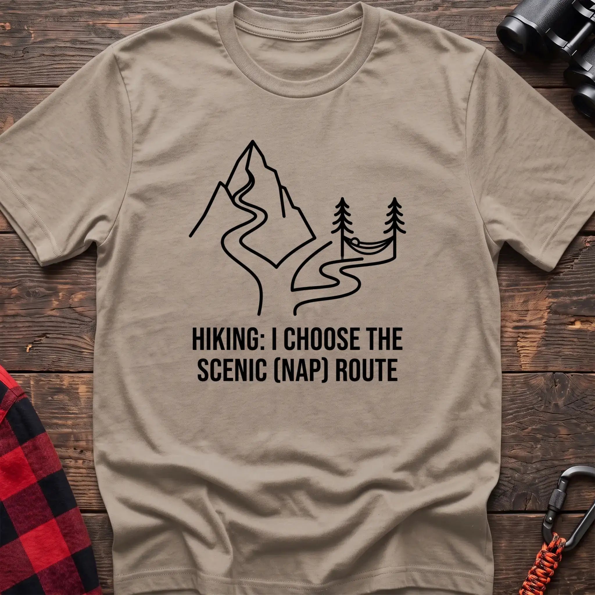 Sand t-shirt with minimalist mountain trail and hammock graphic reading Hiking I Choose the Scenic Nap Route