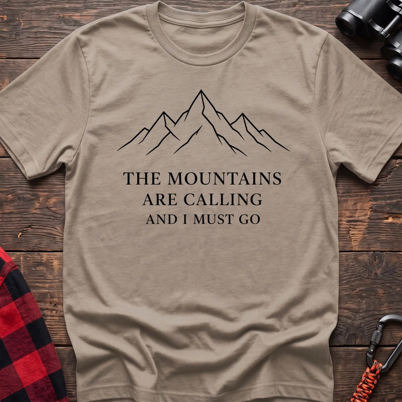 Sand cotton hiking t-shirt with simple mountain line drawing and "The mountains are calling and I must go" quote