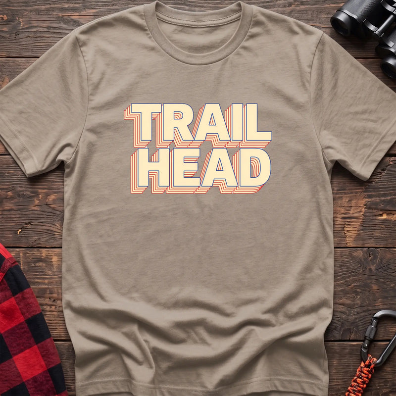 Black cotton t-shirt with retro stacked Trail Head text on rustic wood
