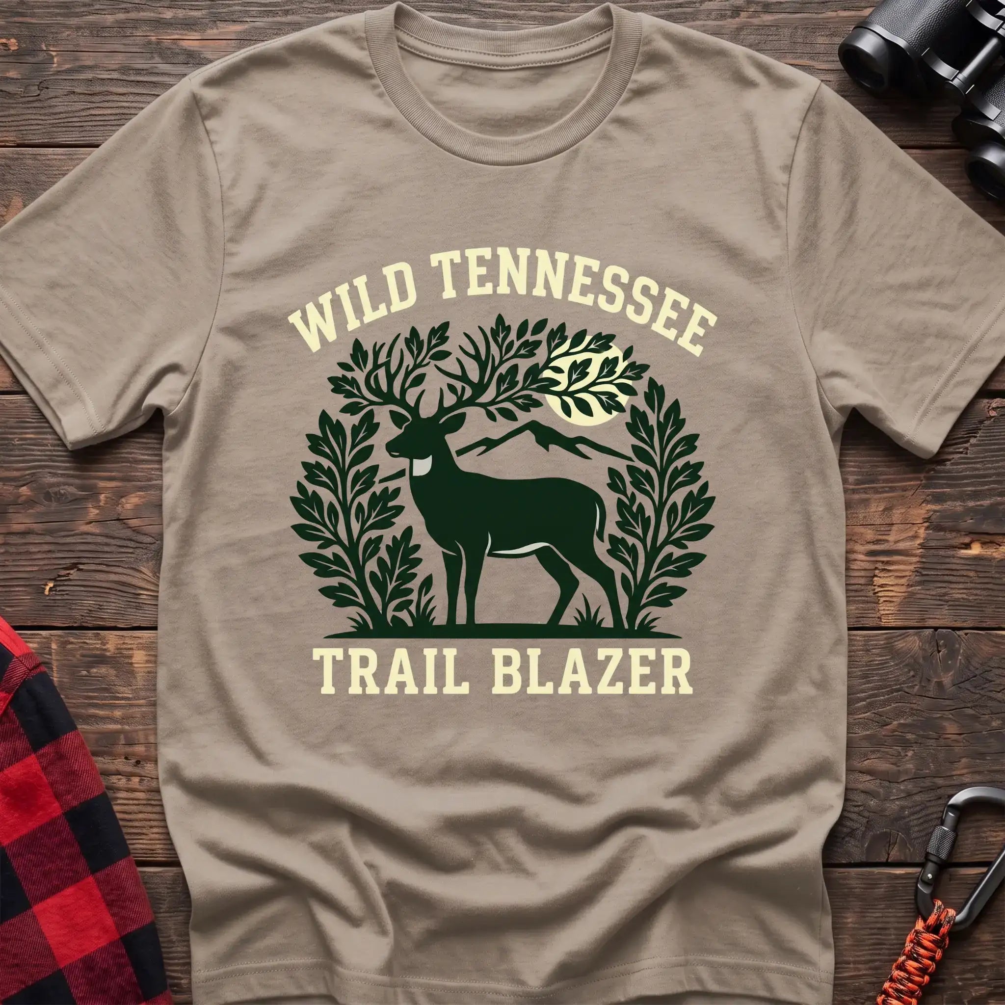 Sand t-shirt with deer among leaves and mountains graphic reading Wild Tennessee Trail Blazer
