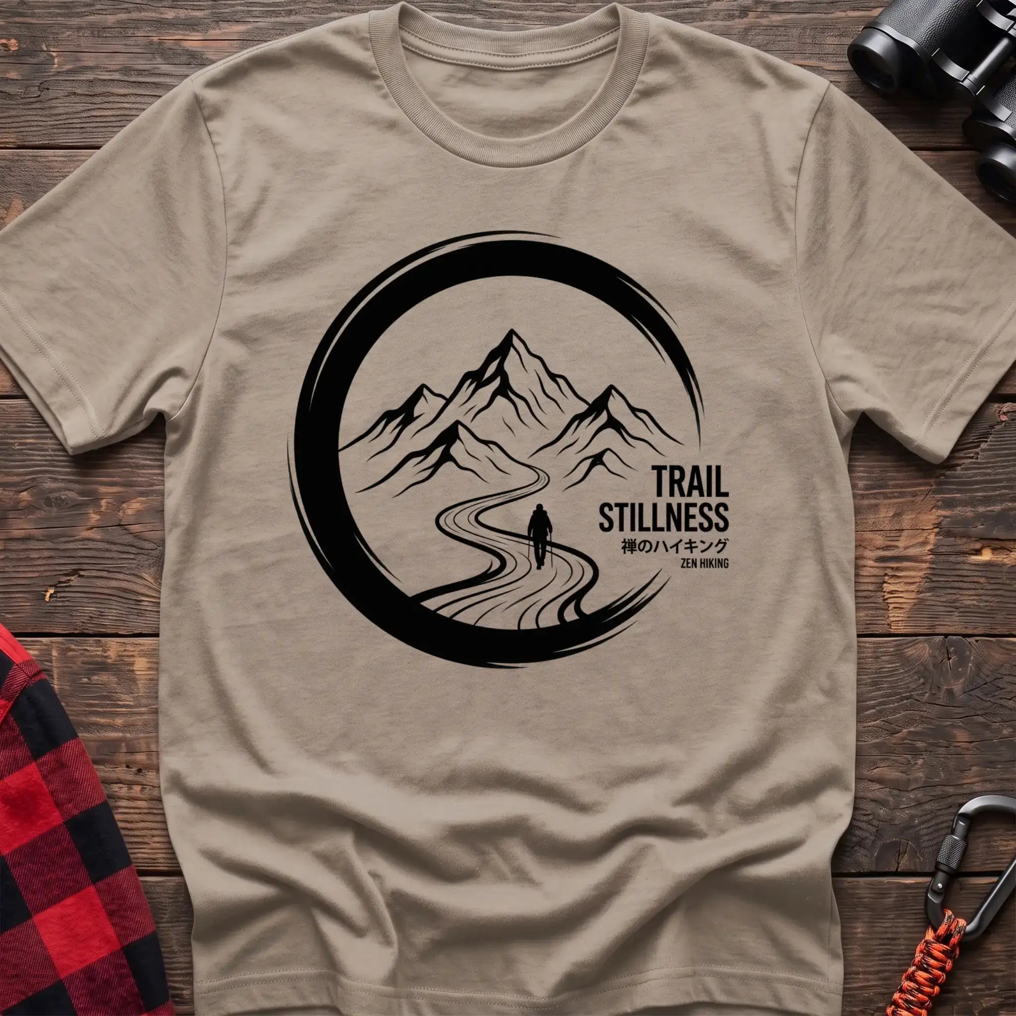 Sand t-shirt with circular mountain trail graphic of a hiker and the text Trail Stillness Zen Hiking