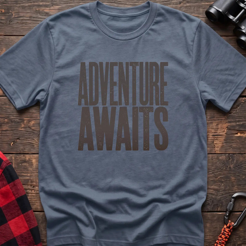 Stone blue t-shirt with large distressed gray text reading Adventure Awaits