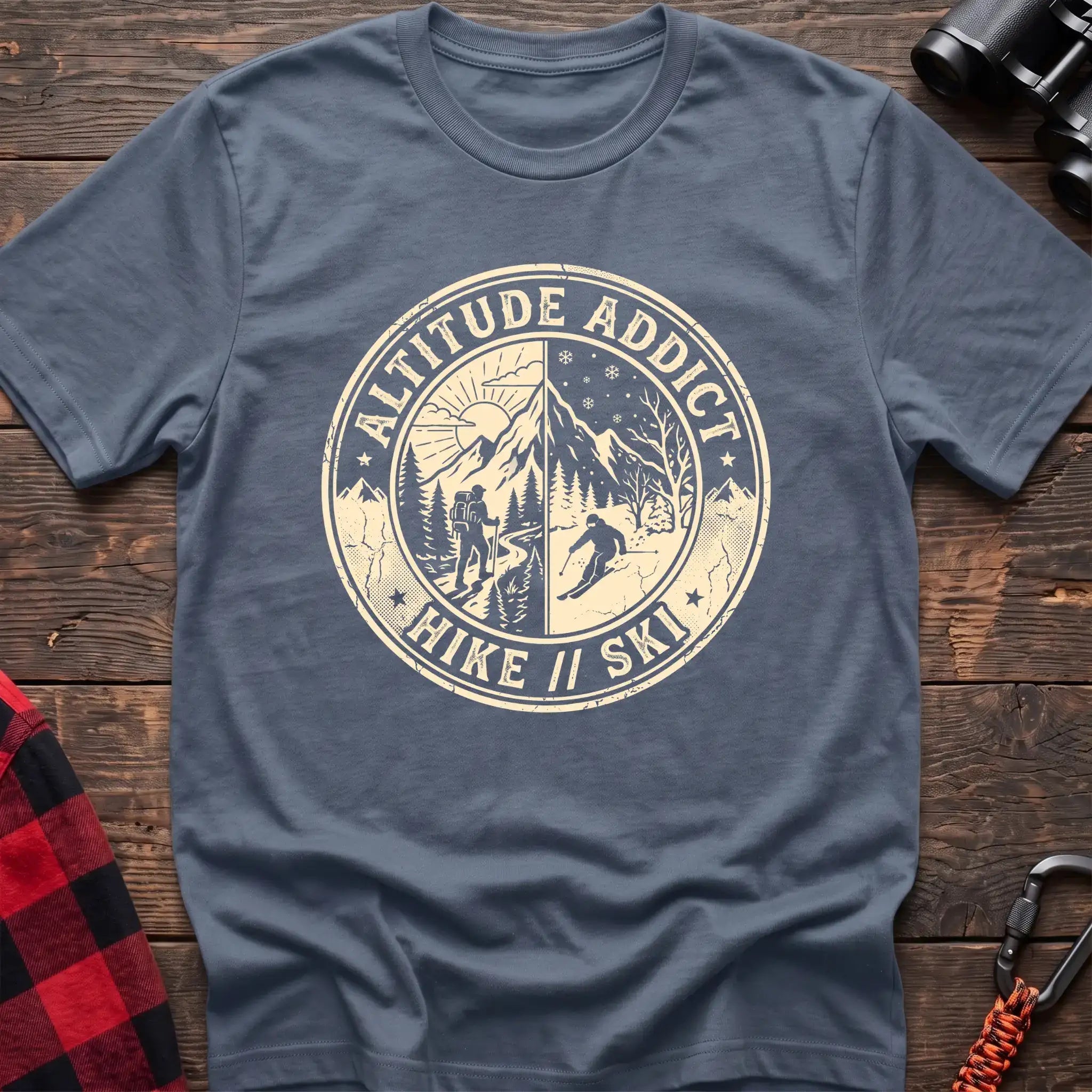 Stone blue t-shirt with circular badge graphic of a hiker and skier on split mountain scenes, reading Altitude Addict Hike Ski