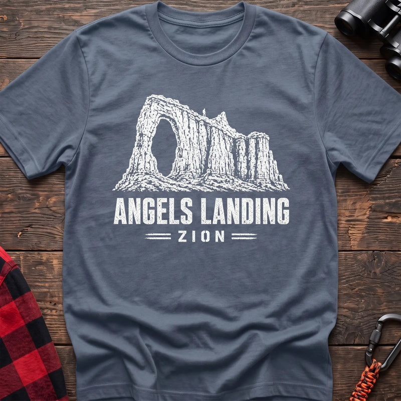 Stone blue cotton t-shirt with a canyon graphic and Angels Landing Zion text on rustic wood