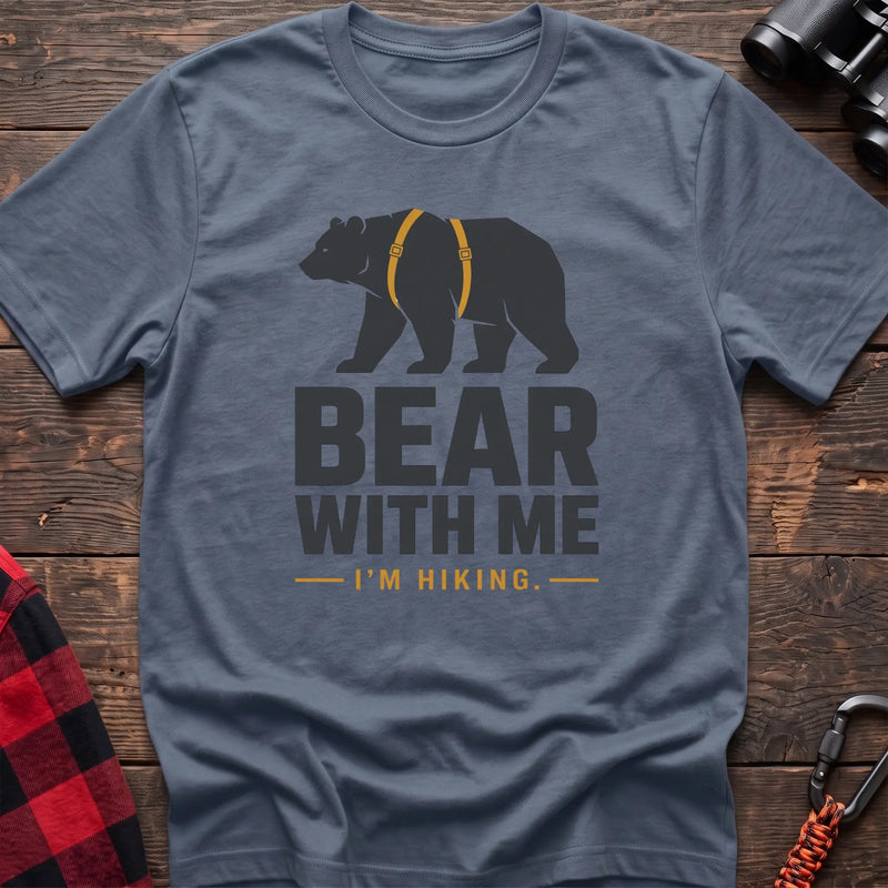 Stone blue cotton hiking t-shirt with black bear wearing a backpack and the text “Bear With Me I’m Hiking”