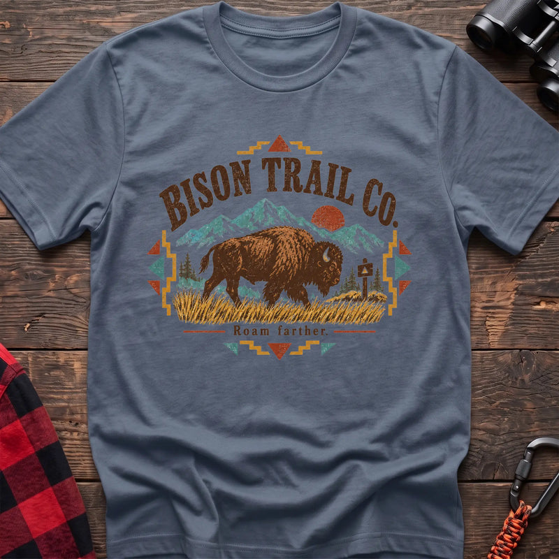 Stone blue cotton t-shirt with a bison and mountain graphic and Bison Trail Co text on rustic wood