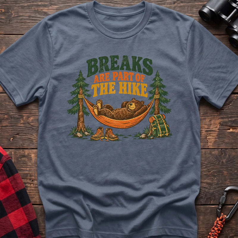 Stone blue cotton t-shirt with a bear in a hammock graphic and Breaks Are Part of the Hike text on rustic wood