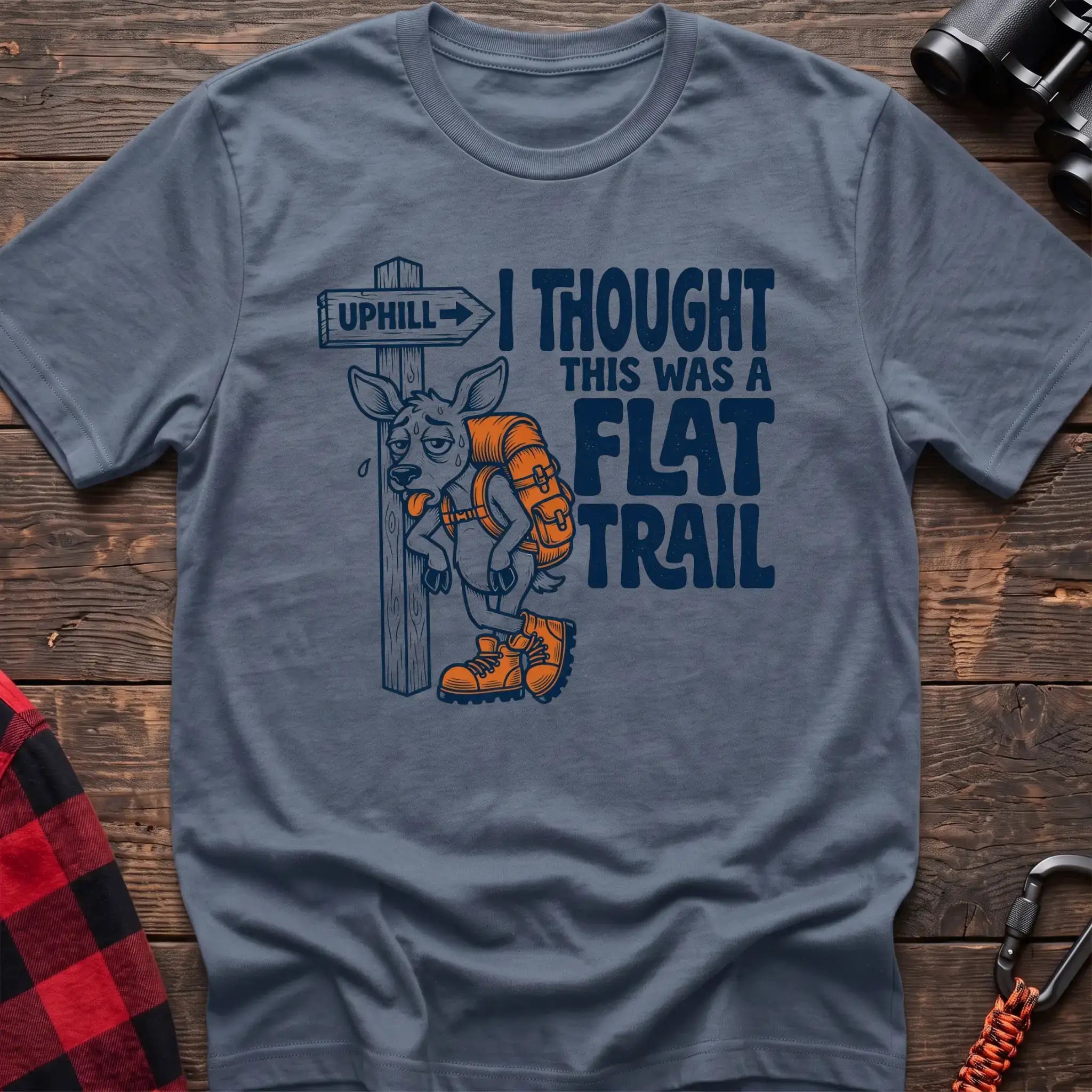 Stone blue t-shirt with exhausted deer leaning on an Uphill trail sign and the text I Thought This Was a Flat Trail